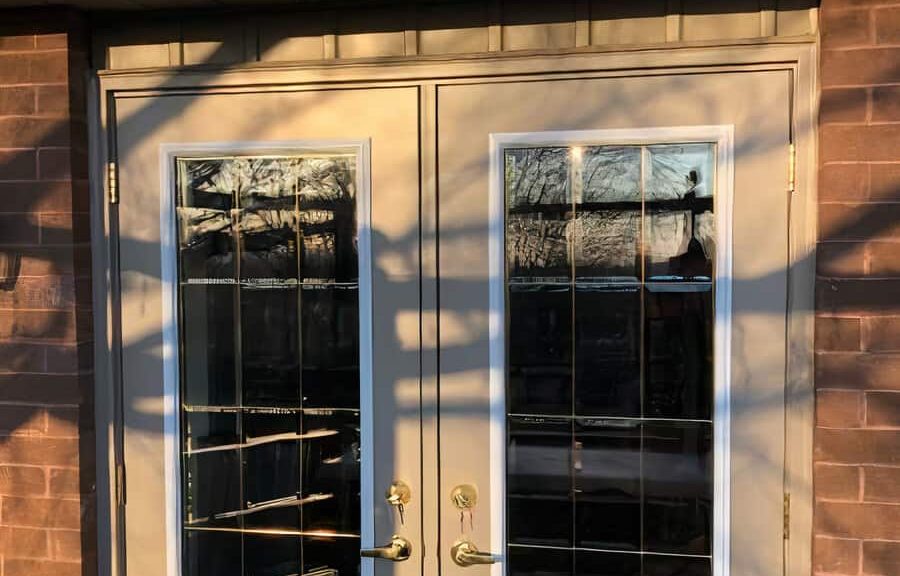 Glass-paneled double doors in sunlight.