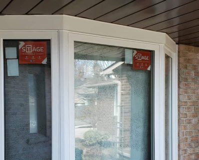 White bay windows with Stage branding.
