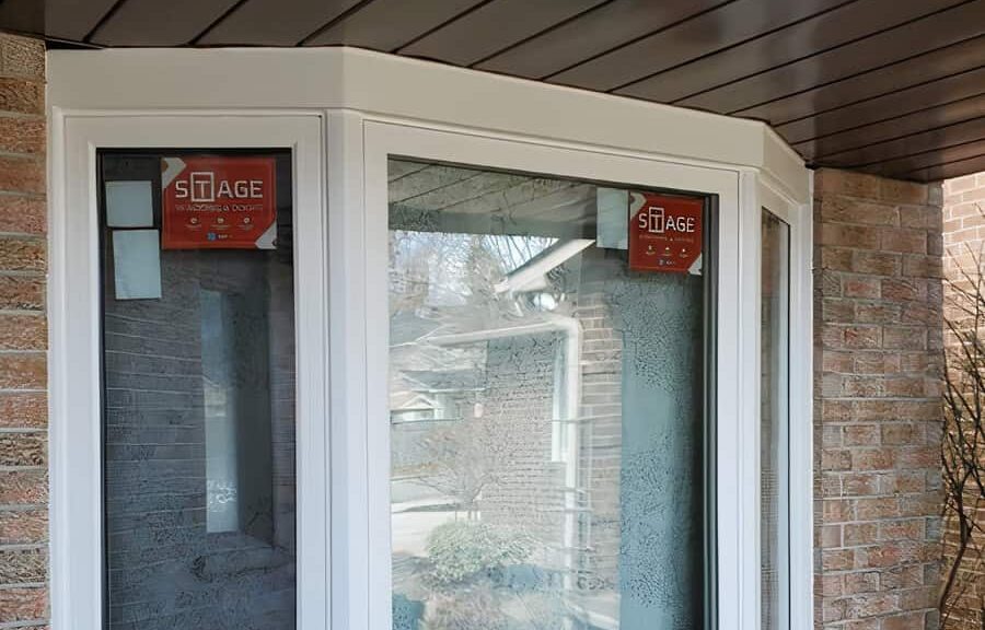 White bay windows with Stage branding.
