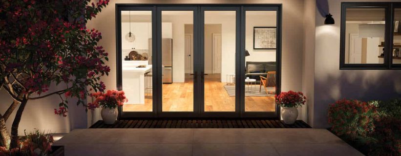 Modern home entrance with glass doors.