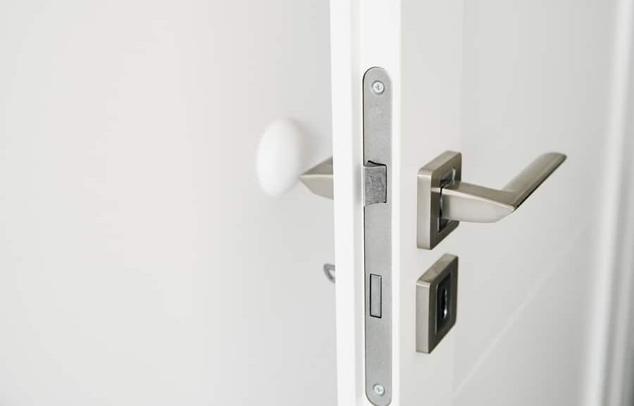 Open white door with silver handle