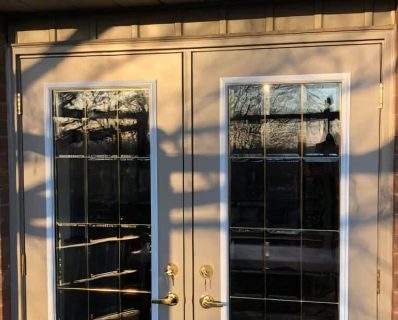 Glass-paneled double doors in sunlight.