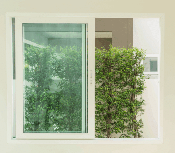 Double lift-out slider window with green view.