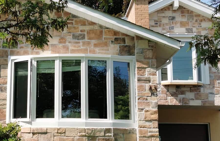 Stone house with large bay window