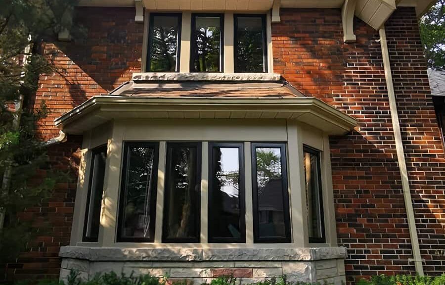 Brick house with bay windows.